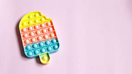 Pop it sensory toy from soft silicone bubbles. Stress and anxiety relief. Trendy game for stressed children and adults.の写真素材