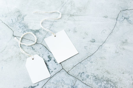 Rectangle tag mockup, square tag mockup with white cord on concrete backgroundの写真素材