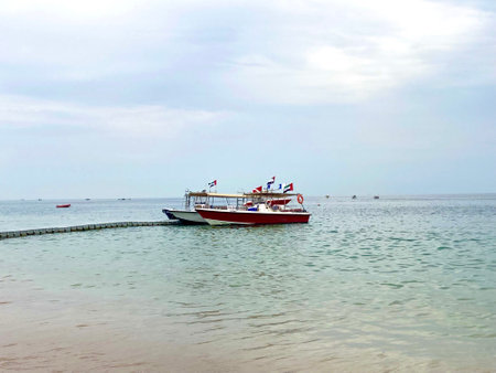 Fishing boat parked near the pier for unloading fish. Close-up. A view from the yachtの写真素材