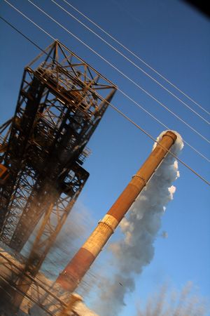Industrial thems with a smoky pipeの写真素材