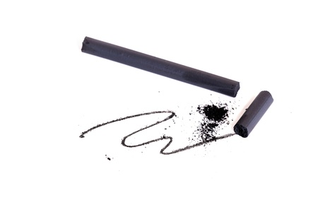 Pieces of charcoal and a curve isolatedの写真素材