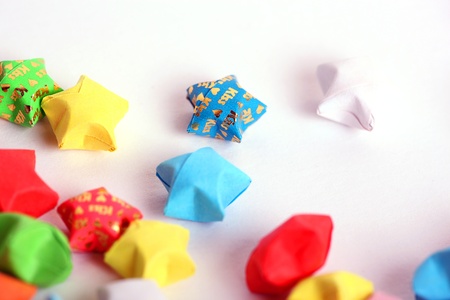 Colour paper Good luck stars on white with a word kiss on some of them