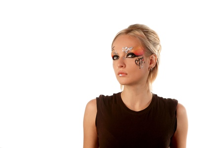A young pretty blond girl with a bright fantasy make up.の写真素材