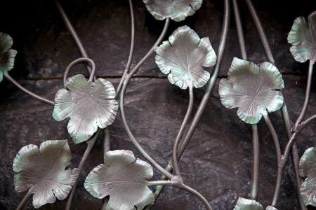 Artistic forge as a vine with leaves on the door  Painted bronze の写真素材