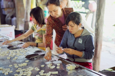 Production of coconut-candies on the Mekong River. Vietnam.のeditorial素材