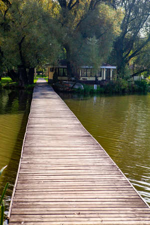 A landscape with a decking over the lake in perspectiveの写真素材