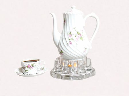 A coffee service on an coffee-heater with cup and saucer on white background.	  50908		.	の写真素材