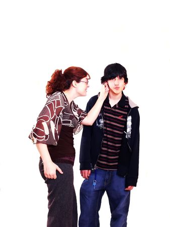 Mother and son  60771		A mother has to discipline her teenage boy for bad behavior. On white	background.	の写真素材