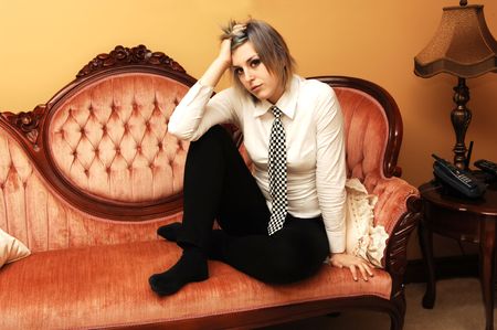 Young girl lying on the sofa.の写真素材