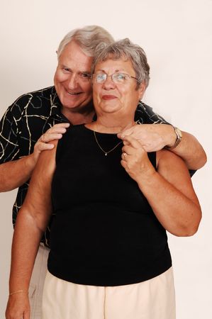 An happy senior couple smiling and happy in front of the camera. 
