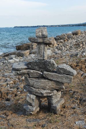 Lake Ontario shore with big rocks and waves splashing on the rocks. の写真素材