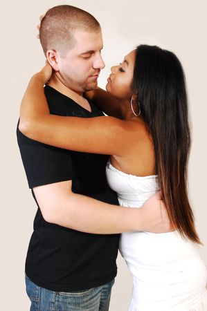 An Asian woman and a Caucasian man hugging each other in love. の写真素材