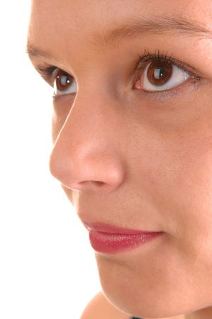 The half face of a beautiful young woman whit her eyes and red lips
on white background.
の写真素材