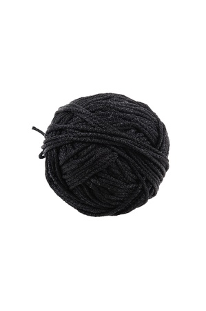 A ball of black braided small robe, made from synthetic yarn, for tying up something, for white background. の写真素材