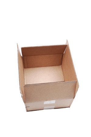 An empty used brown cardboard box sitting on white background  with copy space.