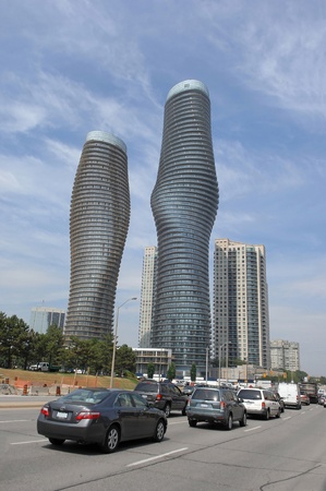 Two modern new high rise building towers in Mississauga in very interestinground forms, the right one is occupied the left one under constructionのeditorial素材