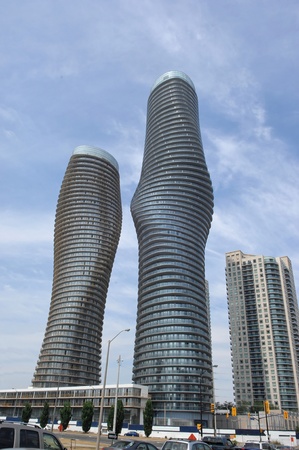 Two modern new high rise building towers in Mississauga in very interestinground forms, the right one is occupied the left one under constructionのeditorial素材