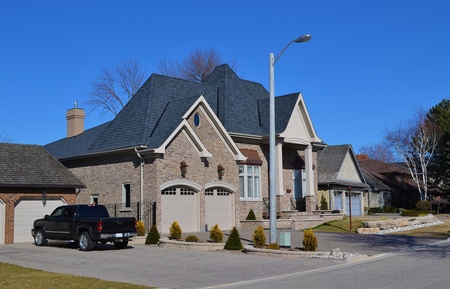 In the suburb of Hamilton on the lake Ontario a new big mansion is build,photo taken under sunny sky in early spring のeditorial素材