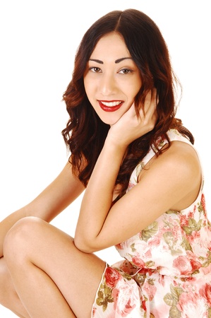 A closeup portrait shot of a pretty woman with long brunette hair and alively smile and red lips, for white background の写真素材
