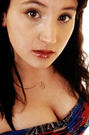 A closeup shot of the face of a young woman with her black hair and red
lips, looking into the camera.
の写真素材