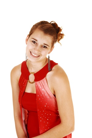 A pretty and young woman from the front in a red short and tight dressstanding for white background with her lovely figure の写真素材