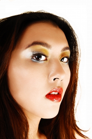 A closeup portrait of a gorgeous chinese woman with great make up,red lips and brunette hair for white background の写真素材