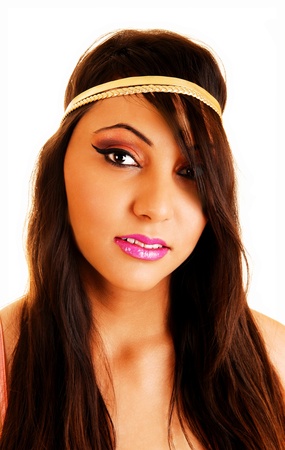 Lovely young woman with long brunette hair looking into the camera in a portrait shoot for white background の写真素材