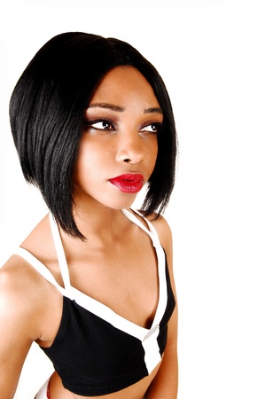 A portrait picture of a young woman with short black hair in an exercisebra for white background の写真素材