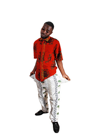 A black young man standing for white background turned his pocketsout to show he has no money の写真素材