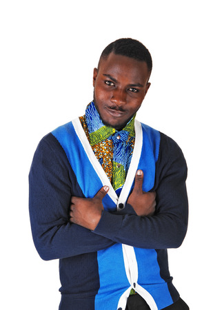 A black young man standing for white background with his arms crossedsmiling into the camera の写真素材