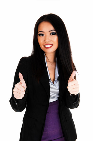 A lovely Asian business woman looking at her cell phone, holding afolder in her hands for white background の写真素材