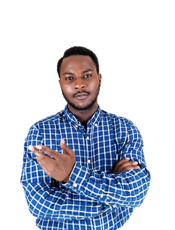 A black young man standing isolated showing with his hand and looking into the camera の写真素材