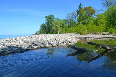 Lakeshore on the lake Ontario on a beautiful sunny spring day with blue sky の写真素材