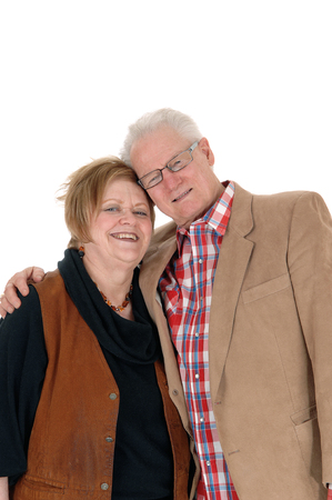 A lovely older couple standing in casual cloth, hugging each other, smiling, isolated for white background.の写真素材