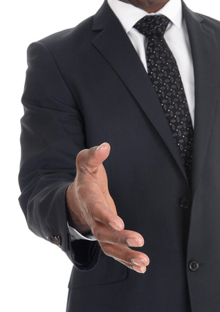 A close-up image of the hand of a business man in a dark suit greeting
somebody, isolated for white background
の写真素材