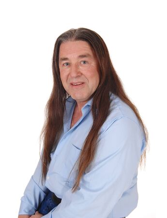 A handsome indigenous man smiling in a portrait shoot with his
long brunette hair, isolated for white backgroundの写真素材