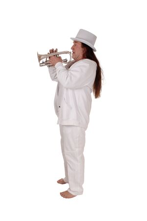 A middle age indigenous man standing in a white outfit and white hat
playing his trumpet with his long hair, isolated for white backgroundの写真素材