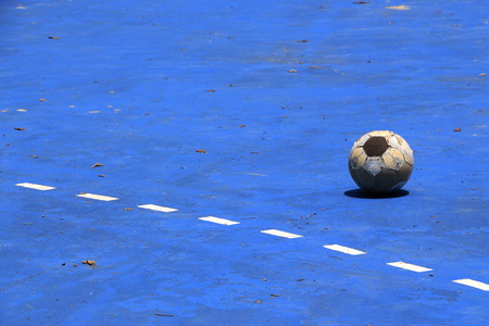 Futsal ball on blue background fieldの写真素材