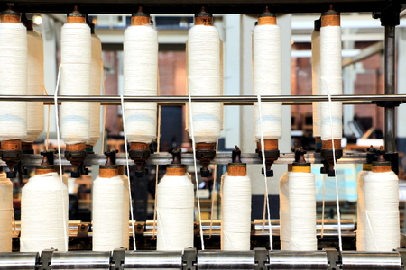 Rolls of spun cotton in a textile factory