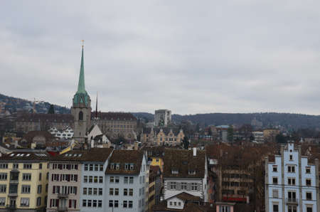 Zurich is a city in northeastern Switzerland, located on the shores of Lake Zurich near its northwestern edge. The city stretches between two wooded ridges of hills.の写真素材