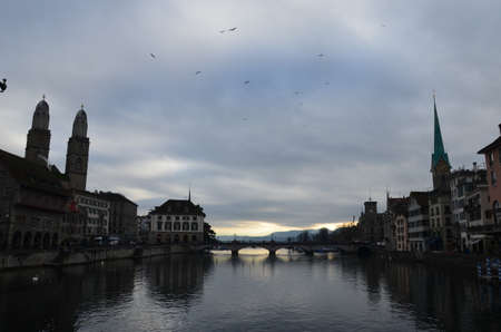 Zurich is a city in northeastern Switzerland, located on the shores of Lake Zurich near its northwestern edge. The city stretches between two wooded ridges of hills.の写真素材