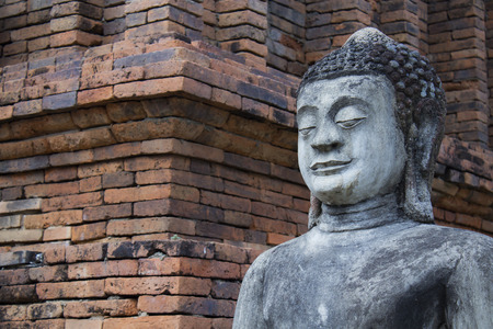 Buddha statue in the temple complex of Cambodiaの写真素材