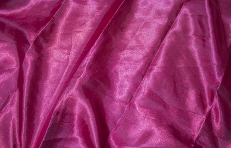 Red Silk cloth of wavy abstract backgroundの写真素材
