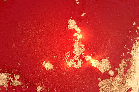 Gold and bright red pattern with texture of geode and sparkles