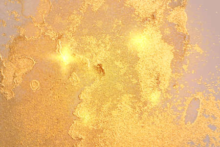Abstract lemon yellow and gold background with marble texture and shining glitter