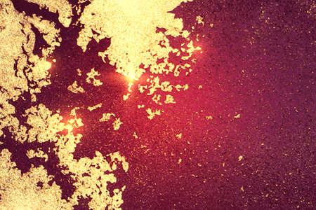 Vinatge shining abstract dark maroon, red and gold marble pattern with sparkles