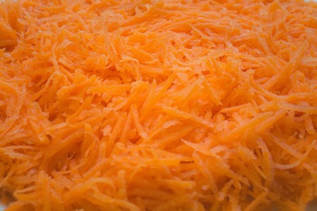Grated fresh orange carrot close-up. Texture, background.の写真素材