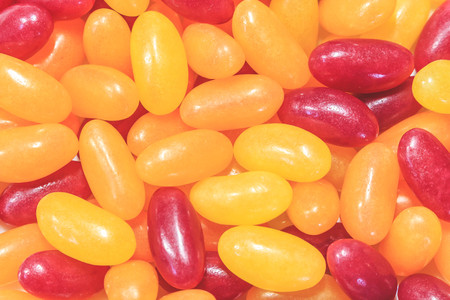 Colorful children's candy. Multivitamins close up. Yellow Red.