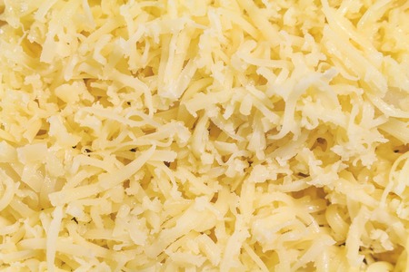 Cheese grated fresh edam close-up without other products one.