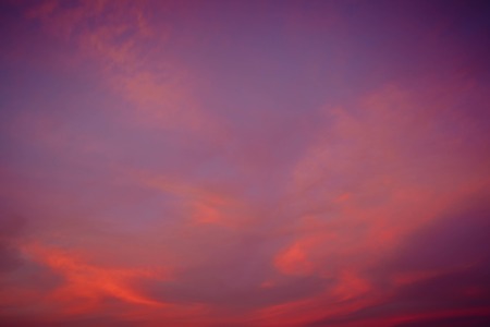 Clouds of beautiful color in the fall. Sunset pink red orange color on the evening sky.